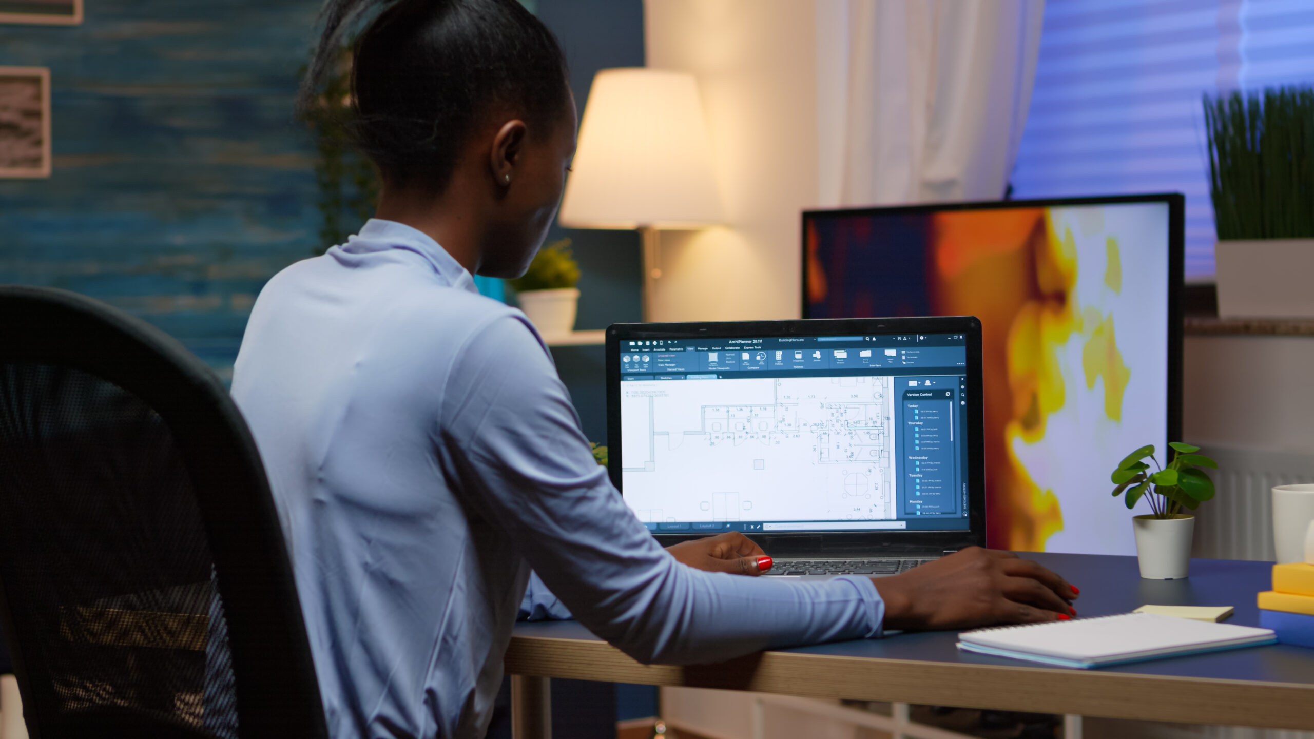 black-employee-checking-digital-blue-prints-analysing-project-company-looking-laptop-sitting-desk-living-room-office-late-night-overtime-busy-african-freelancer-using-modern-technology