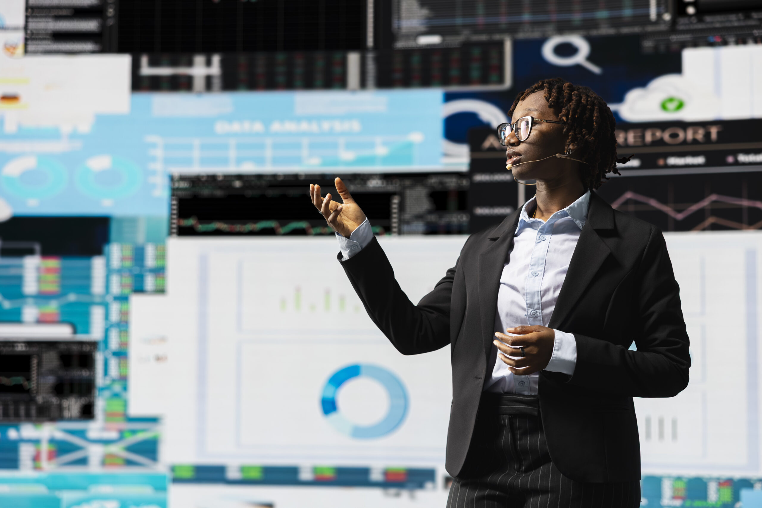 Woman earing suit leads visionary business pitch at event Woman earing suit leads visionary business pitch at event
